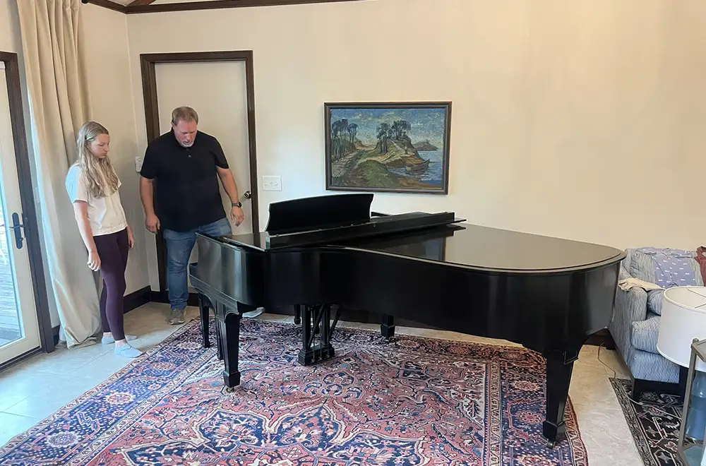 tips-for-renting-a-piano piano movers setting a piano in a room