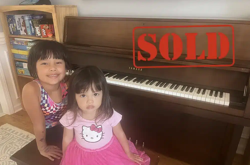 yamaha-p202 two kids sitting at a piano